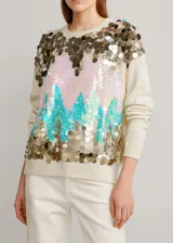 Sweater color crema con lentejuelas doradas, rosas y turquesas.