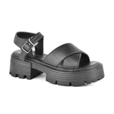 Sandalias color crema con plataforma track y tiras cruzadas.