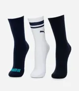Kit de tres pares de medias deportivas Puma de caña larga. Un par color beige con dos rayas marrones horizontales en la parte superior y logo marrón en el tobillo. Un par color crema liso con logo blanco en el tobillo. Un par color marrón con una raya blanca horizontal en la parte superior y logo blanco en el tobillo.