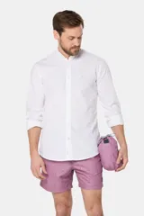 Short de baño clásico azul con estampado de palmeras, con cintura elástica y cordón regulable, dos bolsillos laterales y suspensor de malla fina.