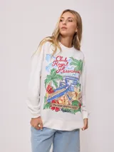 Sweater color crema con estampado frontal de motivos playeros y bordado. Confeccionado en 60% algodón y 40% poliéster.