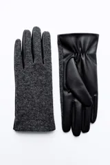 Guantes cortos negros combinados en mezcla de lana y tejido efecto piel, con cierre de botón a presión.
