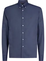Camisa de manga larga Tommy Hilfiger de algodón Oxford color azul con cuello abotonado y logo bordado en el pecho.
