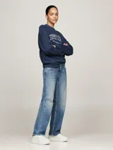 Zapatillas urbanas Tommy Jeans blancas con detalles metalizados en el talón, logo de la marca en el lateral y suela de plataforma.