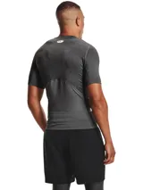 Remera deportiva Under Armour HeatGear Armour de manga corta, color blanco, con logo negro en el pecho.