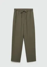 Pantalón fluido color beige con cintura elastizada y detalles de ajuste.