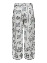 Pantalón cropped de tiro alto confeccionado en viscosa y lino, con estampado floral en tonos blanco y negro. Presenta cintura elastizada en la parte trasera y corte tobillero.