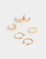 Set de seis earcuffs dorados con diferentes diseños: doble aro liso, hojas, eslabones, círculos calados, bolitas y trenzado.