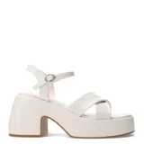Sandalias negras con plataforma y taco ancho, tiras cruzadas sobre el empeine y pulsera con hebilla al tobillo. Marca Miss Carol, modelo XYLO.