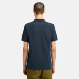 Chomba azul marino de piqué de algodón, corte clásico, cuello polo con dos botones y logo de Timberland bordado en el pecho.
