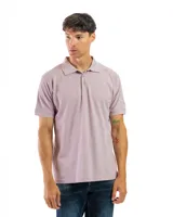 Remera polo verde con cuello y mangas con borde blanco, confeccionada en algodón.