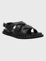 Sandalias negras de cuero con tiras cruzadas y tachas plateadas.