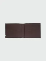 Billetera Longchamp de cuero color verde oliva, con diseño plegable y logo grabado en la parte inferior.
