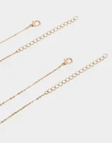 Set de 2 collares dorados para compartir, con cadena de eslabones y dije de planeta con strass rosas y celestes, y dije de corazón.