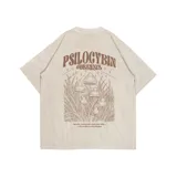 Remera beige de manga corta con cuello redondo y estampado de hongos y texto 'Kaboa' en el pecho.