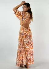 Vestido largo de viscosa con estampado animal print de cebra en blanco y negro, con escote en V, mangas largas abullonadas y cintura elastizada con lazo.