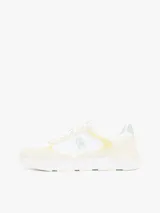 Zapatillas Tommy Hilfiger de mujer, color blanco con detalles en amarillo y verde. Presentan el logo de la marca en el lateral y están confeccionadas con una mezcla de texturas.