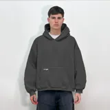 Buzo hoodie celeste de felpa, corte oversize, con capucha y puños acanalados. Estampado en la espalda con el texto "venefa" en tipografía futurista y la frase "WHERE FEAR FLIPS INTO YLE. STREET-BORN, FUTURE-BOUND.".