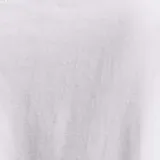 Remera blanca de corte boxy con estampa roja de la palabra "Bonjour" en el frente.