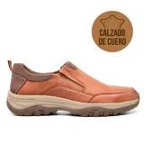 Zapato casual de cuero negro, sin cordones, con elásticos laterales y suela de goma.