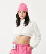 Buzo cropped blanco de algodón con cuello alto y puños acanalados.