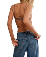 Top de manga larga negro, transparente y texturado, con cuello fruncido y terminación elástica.