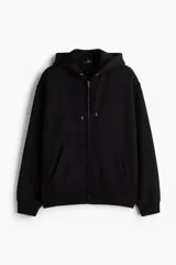 Campera con capucha H&M de felpa negra con interior cepillado suave. Tiene cierre frontal, bolsillos delanteros, puños y bajo en punto acanalado. Corte holgado.
