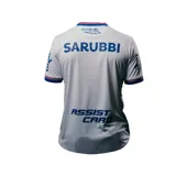 Camiseta de fútbol Umbro del Club Nacional de Football, modelo Home 2025 para dama. Diseño blanco con detalles en azul y rojo en cuello y mangas. Incluye logo de Umbro, escudo del club y sponsor Antel en el frente.