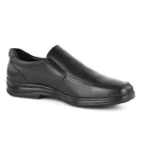 Zapato de vestir negro de cuero liso, sin cordones, con elásticos laterales y suela de goma.