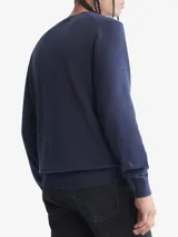 Sweater azul marino de algodón con cuello redondo y logo CK bordado en el pecho.