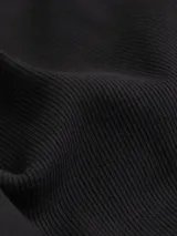 Vestido negro de canalé con tirantes finos y logo de Calvin Klein Jeans en el pecho.
