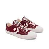 Championes Converse Star Player EV Ox color bordó con detalles en blanco.