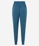 Pantalón tipo jogger de color beige claro, con cintura elástica y lazo ajustable. Corte ajustado en los tobillos.