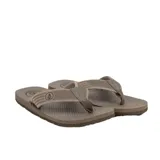 Ojotas marrones de goma con plantilla texturizada y logo de Volcom en la tira.