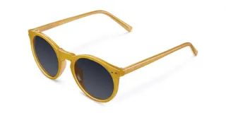 Lentes de sol redondos con montura de policarbonato color amarillo y lentes polarizados negros.