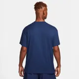 Camiseta de corte holgado con gráficos estampados de flores en la parte frontal, de la marca Nike.