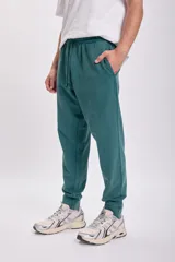 Pantalón de jogging verde petróleo con cintura ajustable con cordón.