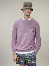 Sweater lila de algodón con cuello redondo y manga larga.