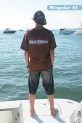 Camiseta celeste con estampado frontal y trasero con el texto "Ittai Stars" en color rojo y azul.