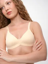 Soutien color beige con breteles regulables.