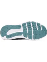 Championes de running Under Armour Charged Surge 4 color celeste con logo de la marca en el lateral.