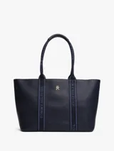Bolso tote azul marino de poliuretano con cierre de cremallera, doble asa superior con inscripción de Tommy Hilfiger y logo TH dorado en el frente.