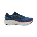 Championes de running New Balance Fresh Foam X Evoz v4, color azul con detalles en negro, rojo y amarillo.