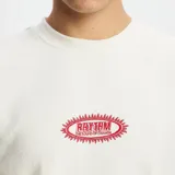 Remera color crema de manga corta con logo Rhythm estampado en el pecho.