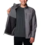 Chaqueta softshell Columbia para hombre, color gris, con cierre frontal, cuello alto, puños y dobladillo ajustables. Presenta bolsillos laterales y un bolsillo en el pecho, todos con cierre.