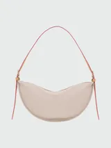 Bandolera Longchamp modelo Crossbody Smoothie M, color gris topo, con correa ajustable y cierre de cremallera.