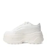 Championes Puma Karmen x de cuero sintético color marfil, con plataforma y detalles dorados.