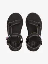Sandalias de plataforma negras con suela dentada gruesa. Presentan tiras de tejido trenzado ajustables con velcro y un parche tonal con el logo de Tommy Jeans.