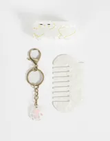 Set de accesorios para el pelo color blanco con diseño de gato, que incluye un peine, un broche y un llavero con dije de huella de gato.