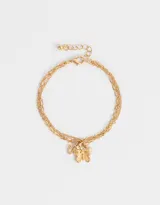 Pulsera dorada de eslabones con tres cadenas y dije de mariposa con strass.